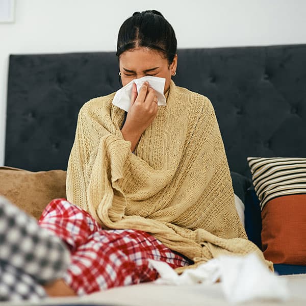 Sick employee in bed with flu