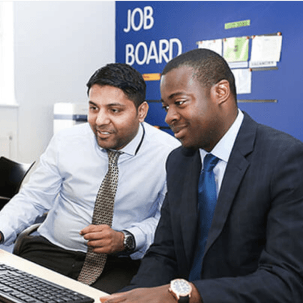 Two men using computer